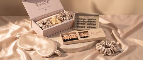 Aimée STHLM nails, lashes and silk accessories on champagne fabric